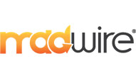 Logo of trivia company Macwire featuring stylized black and orange text.